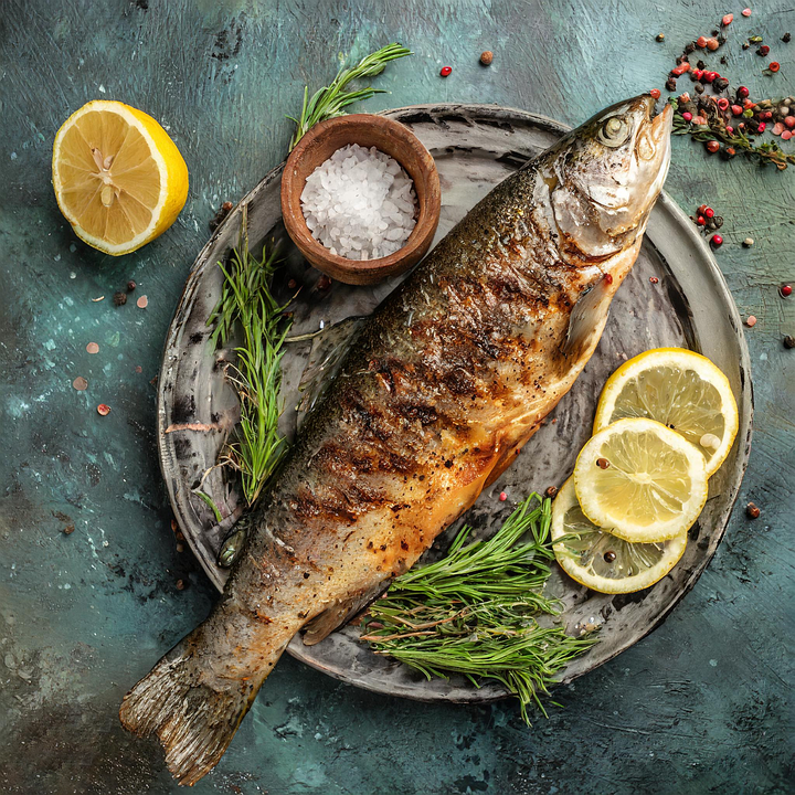 ''Salmon fish on plate - fatty fish supporting heart and kidney health,''